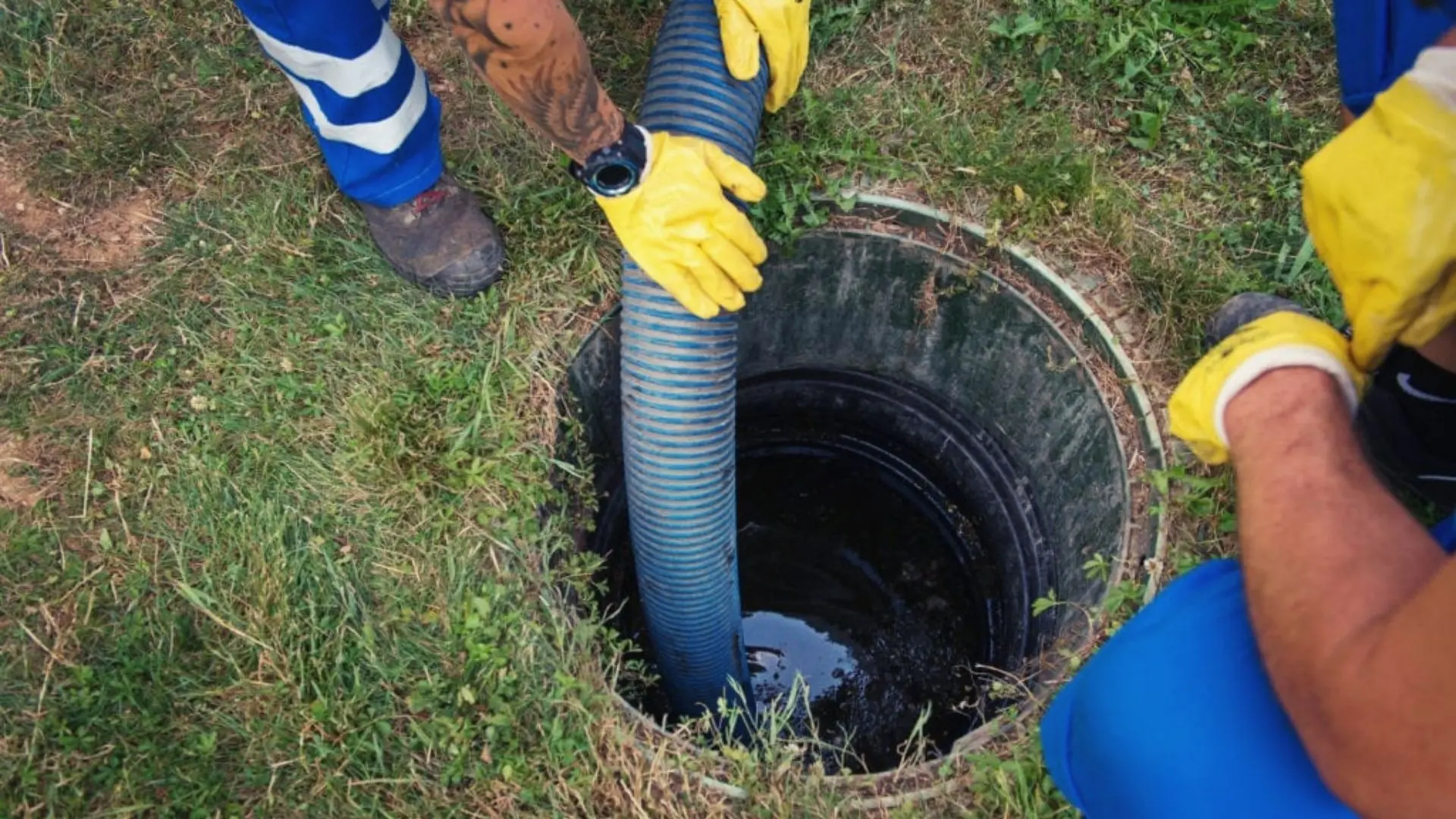 plumbers-clearing-clogged-sewer-drain